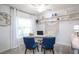 Bright office with a large window, carpet and shelving creating a functional workspace at 1794 Daystar Dr, Haines City, FL 33844