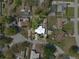 Aerial view of the property showing the landscaped yard, pool area, and neighborhood at 2020 Indian Trl, Lakeland, FL 33813