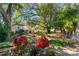 Landscaped backyard with tropical plants and decorative items at 2020 Indian Trl, Lakeland, FL 33813