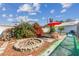 Backyard features a custom stone fire pit with bench seating and yard games at 2020 Indian Trl, Lakeland, FL 33813