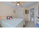 Cozy bedroom featuring a ceiling fan, carpeted floor, and a double-door closet at 2020 Indian Trl, Lakeland, FL 33813