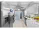 Well-lit kitchen featuring stainless steel appliances, granite countertops, and ample cabinet space at 2020 Indian Trl, Lakeland, FL 33813