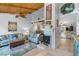 Inviting living room boasts a wooden ceiling, cozy seating, and a decorative fireplace at 2020 Indian Trl, Lakeland, FL 33813