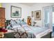 Bedroom featuring a comfortable bed, wood floors, and natural light from the sliding door at 2126 Sandy Hook, Lakeland, FL 33813