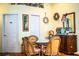 Charming dining area with rattan chairs and unique decor elements at 2126 Sandy Hook, Lakeland, FL 33813