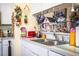 Kitchen featuring white countertops, stainless steel sink, and wall decor at 2126 Sandy Hook, Lakeland, FL 33813