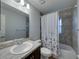 Well-lit bathroom with shower, bathtub, and vanity at 236 Talladega Ln, Polk City, FL 33868