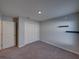 Bedroom with carpet, a closet, and wall-mounted shelf at 236 Talladega Ln, Polk City, FL 33868