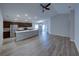 Open-concept living room and kitchen featuring modern floors and plenty of natural light at 236 Talladega Ln, Polk City, FL 33868