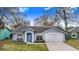 Charming single-story home featuring a well-manicured lawn and attached two-car garage at 2613 Sundance Cir, Mulberry, FL 33860