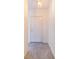 Hallway features neutral walls, a light fixture, and tile floors, creating a clean, modern feel at 2613 Sundance Cir, Mulberry, FL 33860