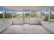 Enclosed patio with tile flooring, offering a view of the backyard at 2613 Sundance Cir, Mulberry, FL 33860