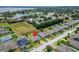 Aerial view of community neighborhood with surrounding green spaces and lakes at 288 Bentley Oaks Blvd, Auburndale, FL 33823