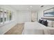 Comfortable bedroom featuring neutral carpet, white walls and shuttered windows for relaxing natural light at 2900 Grasslands Dr, Lakeland, FL 33803