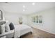 Bright and airy bedroom with a view of the neighborhood trees and a connecting door at 2900 Grasslands Dr, Lakeland, FL 33803