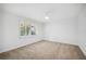Bedroom featuring neutral carpet, white walls, and shuttered windows for filtering natural light at 2900 Grasslands Dr, Lakeland, FL 33803