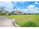 Elegant clubhouse overlooking the golf course, showcasing a spacious layout and beautiful architecture at 2900 Grasslands Dr, Lakeland, FL 33803
