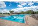 Community pool with lounge chairs for relaxing and lane markers for exercise at 2900 Grasslands Dr, Lakeland, FL 33803