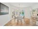 Bright dining area features a round table and a view of the pool and outdoor space through sliding glass doors at 2900 Grasslands Dr, Lakeland, FL 33803