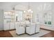 Bright dining room featuring hardwood floors, white walls, modern decor, and ample space at 2900 Grasslands Dr, Lakeland, FL 33803