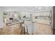 Open floor plan with a kitchen island and bar stool seating, flowing into the living room at 2900 Grasslands Dr, Lakeland, FL 33803