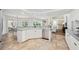 Bright kitchen with bar seating, stainless steel appliances, and an open concept design at 2900 Grasslands Dr, Lakeland, FL 33803