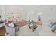 Bright living room featuring hardwood floors, white walls, comfortable seating, and modern decor at 2900 Grasslands Dr, Lakeland, FL 33803
