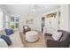 Bright living room with neutral palette featuring a built-in and shuttered windows at 2900 Grasslands Dr, Lakeland, FL 33803