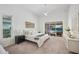 Spacious main bedroom has a ceiling fan, view of pool, and an ensuite bathroom at 2900 Grasslands Dr, Lakeland, FL 33803