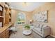 Stylish office with a built-in bookshelf, seating area and arched window at 2900 Grasslands Dr, Lakeland, FL 33803