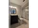 Bathroom featuring a dark vanity, toilet, and shower at 320 Eron Way # 6, Winter Garden, FL 34787