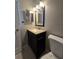 Bathroom featuring a toilet, dark vanity, and mirror at 320 Eron Way # 6, Winter Garden, FL 34787