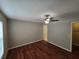 Bedroom with ceiling fan, hardwood floors, neutral paint, window and base molding at 320 Eron Way # 6, Winter Garden, FL 34787