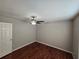Bedroom with hardwood floors, ceiling fan, neutral paint, and ample natural light at 320 Eron Way # 6, Winter Garden, FL 34787