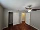 Bedroom featuring wood floors, closet, and ceiling fan at 320 Eron Way # 6, Winter Garden, FL 34787