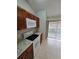 Well-lit kitchen with modern appliances, granite countertops, and a sliding door at 320 Eron Way # 6, Winter Garden, FL 34787