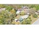 Aerial photo showcasing the house, buildings, and trees at 3995 Townley Dr, Mulberry, FL 33860