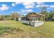 View of the home's backyard featuring a covered patio area at 3995 Townley Dr, Mulberry, FL 33860