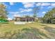 Backyard view showing the home's screened-in patio at 3995 Townley Dr, Mulberry, FL 33860