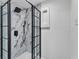Sleek black framed shower with white marble tile surround and fixtures at 3995 Townley Dr, Mulberry, FL 33860