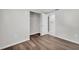 Cozy bedroom with laminate flooring, closet, and interior door at 3995 Townley Dr, Mulberry, FL 33860