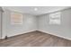 Bedroom features beautiful laminate flooring and natural light at 3995 Townley Dr, Mulberry, FL 33860