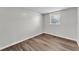Bedroom with natural light and laminate wood-look flooring at 3995 Townley Dr, Mulberry, FL 33860