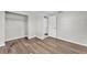 Bright bedroom featuring wood-look floors, closet and fresh paint at 3995 Townley Dr, Mulberry, FL 33860