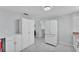Bright kitchen featuring white appliances, cabinets, and marble floors at 3995 Townley Dr, Mulberry, FL 33860