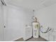 Functional laundry room with sink and water heater at 3995 Townley Dr, Mulberry, FL 33860