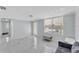 Inviting living room with tile flooring, neutral paint, and large windows at 3995 Townley Dr, Mulberry, FL 33860