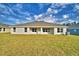 Expansive backyard featuring lush grass and an inviting outdoor living space at 4062 Tullamore Ln, Auburndale, FL 33823