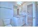 Bright bathroom with tile flooring, granite countertops, a single sink vanity, and toilet at 4062 Tullamore Ln, Auburndale, FL 33823