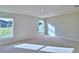 Sun-drenched bedroom featuring plush carpeting and double windows at 4062 Tullamore Ln, Auburndale, FL 33823